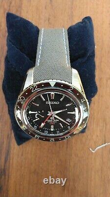 Grand seiko Spring Drive GMT Sbge001 withextra leather lined fitted cordura strap