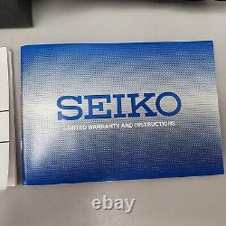 Seiko World Time Watch Men 40mm White Dial Silver Tone Date Alarm Round SPL055